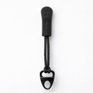 Black bottle opener with textured handle on a white background
