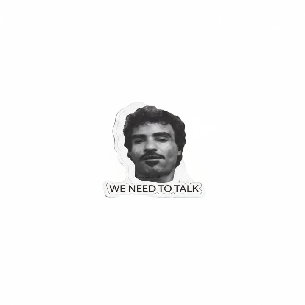 A die-cut sticker featuring a black and white portrait of a man with a mustache above the text 'WE NEED TO TALK' on a plain white background.