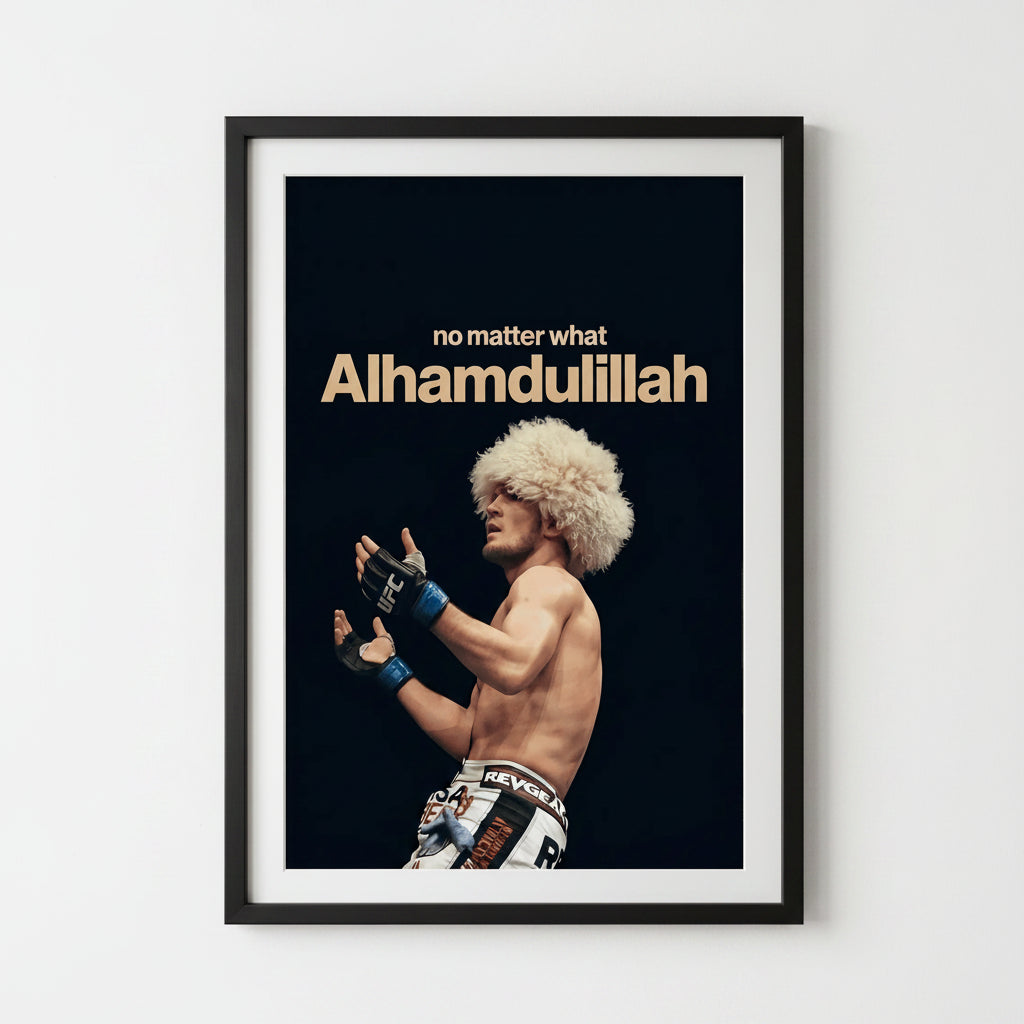 A framed motivational poster featuring a photo of UFC fighter Dhiman 'Big Bird' Karatayev with the text 'no matter what Alhamdulillah' on a black background, displayed on a light gray wall.