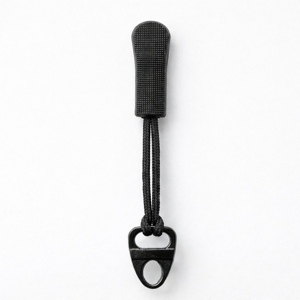 Black bottle opener with textured handle on a white background