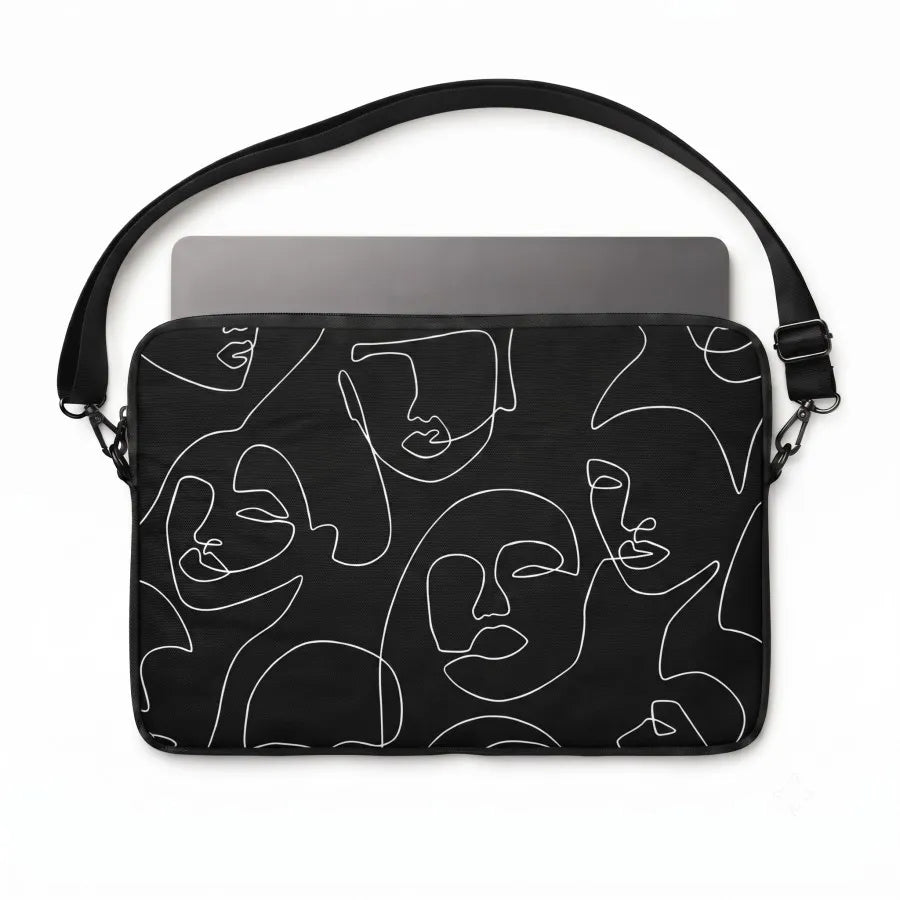 A black laptop sleeve featuring a minimalist white continuous line art pattern of faces, shown with a gray laptop inside on a white background.